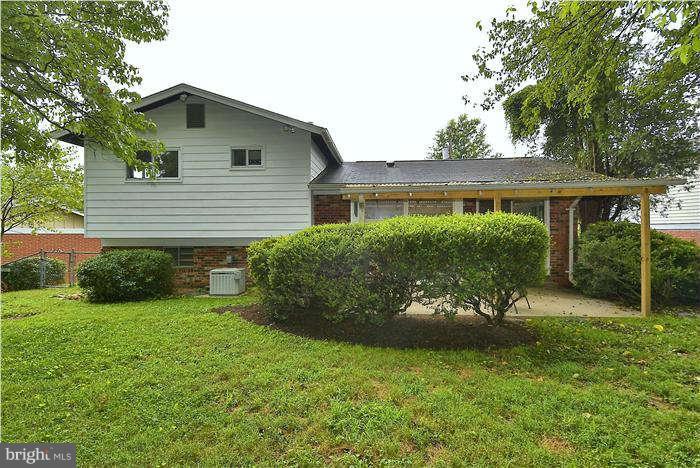 305 Irwin Street Silver Spring, MD 20901 - Photo 23 of 23 a view of a house with a yard and plants