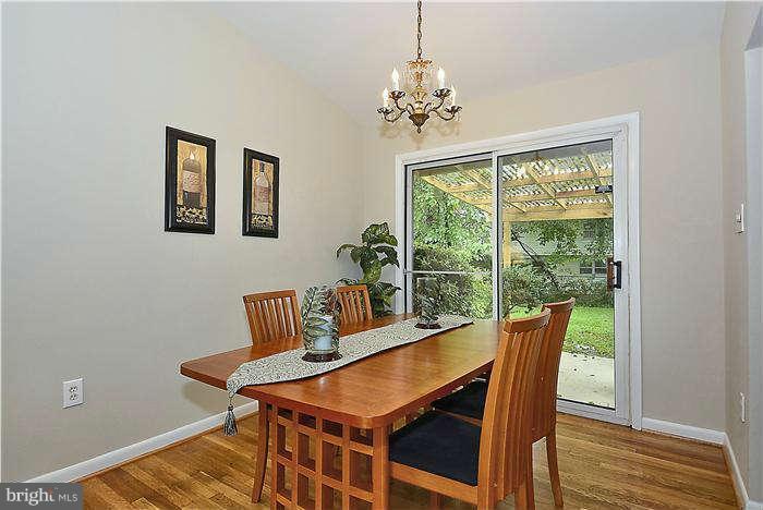 305 Irwin Street Silver Spring, MD 20901 - Photo 5 of 23 a view of a dining room with furniture window and wooden floor