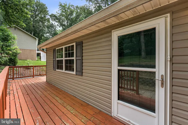 a view of backyard with a deck