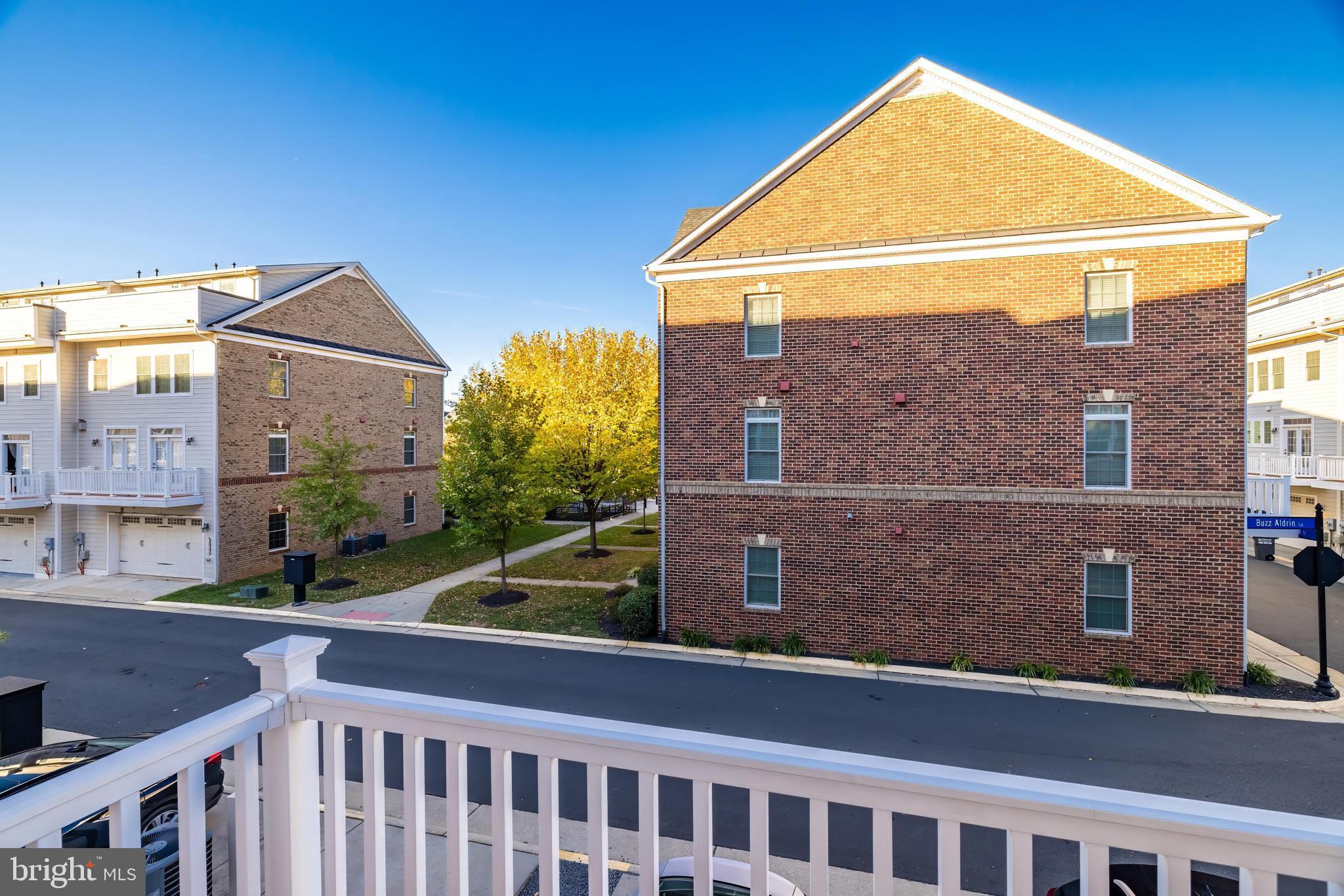 13660 Endeavour Drive, Unit 20C Herndon, VA 20171 - Photo 32 of 35 a view of a brick house with a large windows