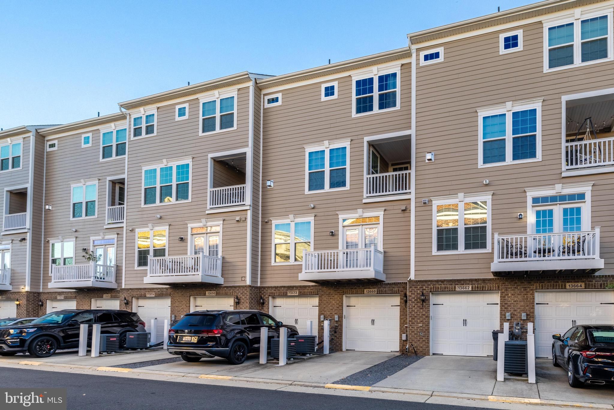 13660 Endeavour Drive, Unit 20C Herndon, VA 20171 - Photo 33 of 35 a car parked in front of a building