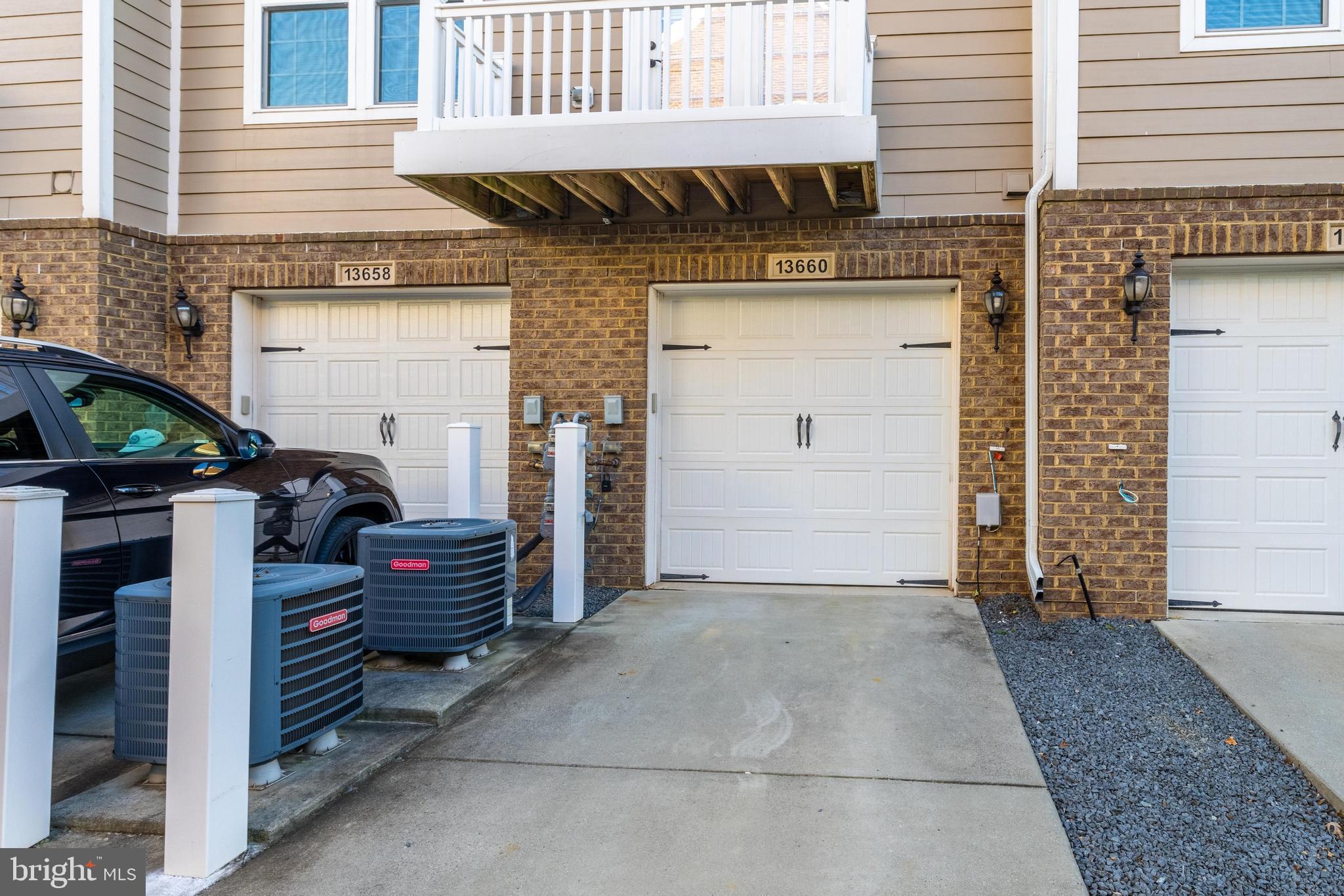 13660 Endeavour Drive, Unit 20C Herndon, VA 20171 - Photo 35 of 35 a view of a house with a barbeque and wooden stairs
