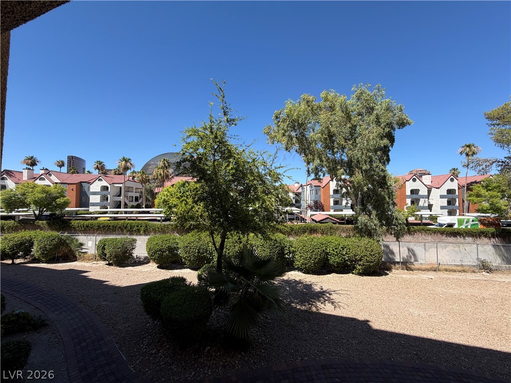 210 East Flamingo Road, Unit 126 Las Vegas, NV 89169 - Photo 16 of 16 An inviting community view with diverse architecture and lush landscaping.