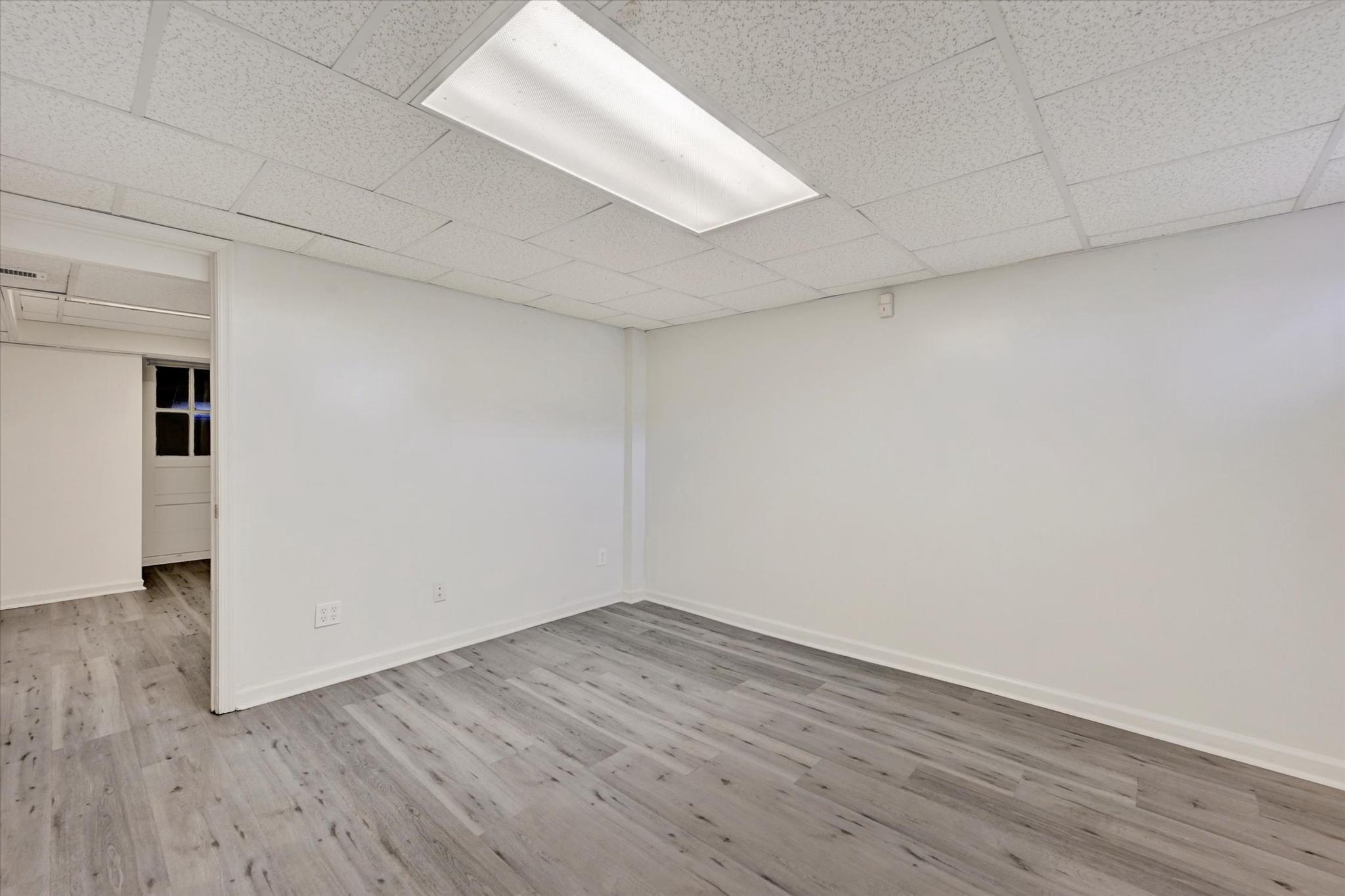 7007 Bank Street Baltimore, MD 21224 - Photo 11 of 17 wooden floor in an empty room
