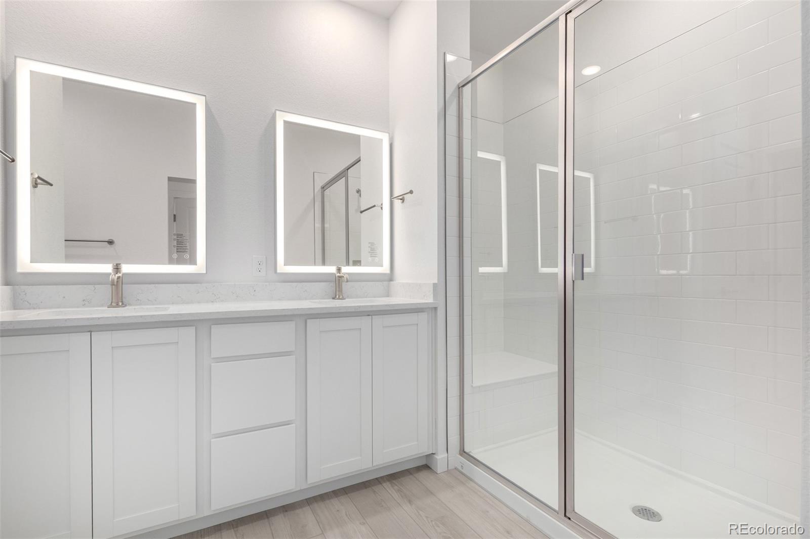 6153 North Ceylon Street, Unit 303 Denver, CO 80249 - Photo 12 of 21 a bathroom with a shower and a sink