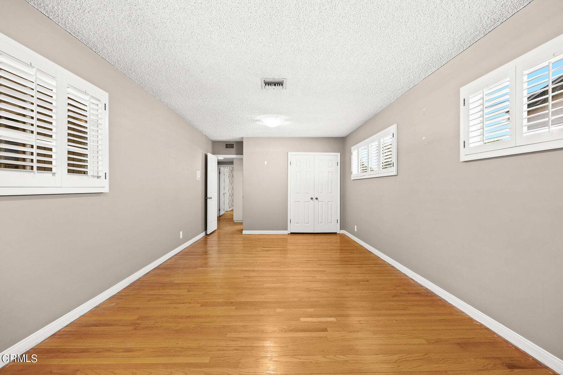 1321 South Eighth Avenue Arcadia, CA 91006 - Photo 18 of 47 a view of an empty room with wooden floor and a window