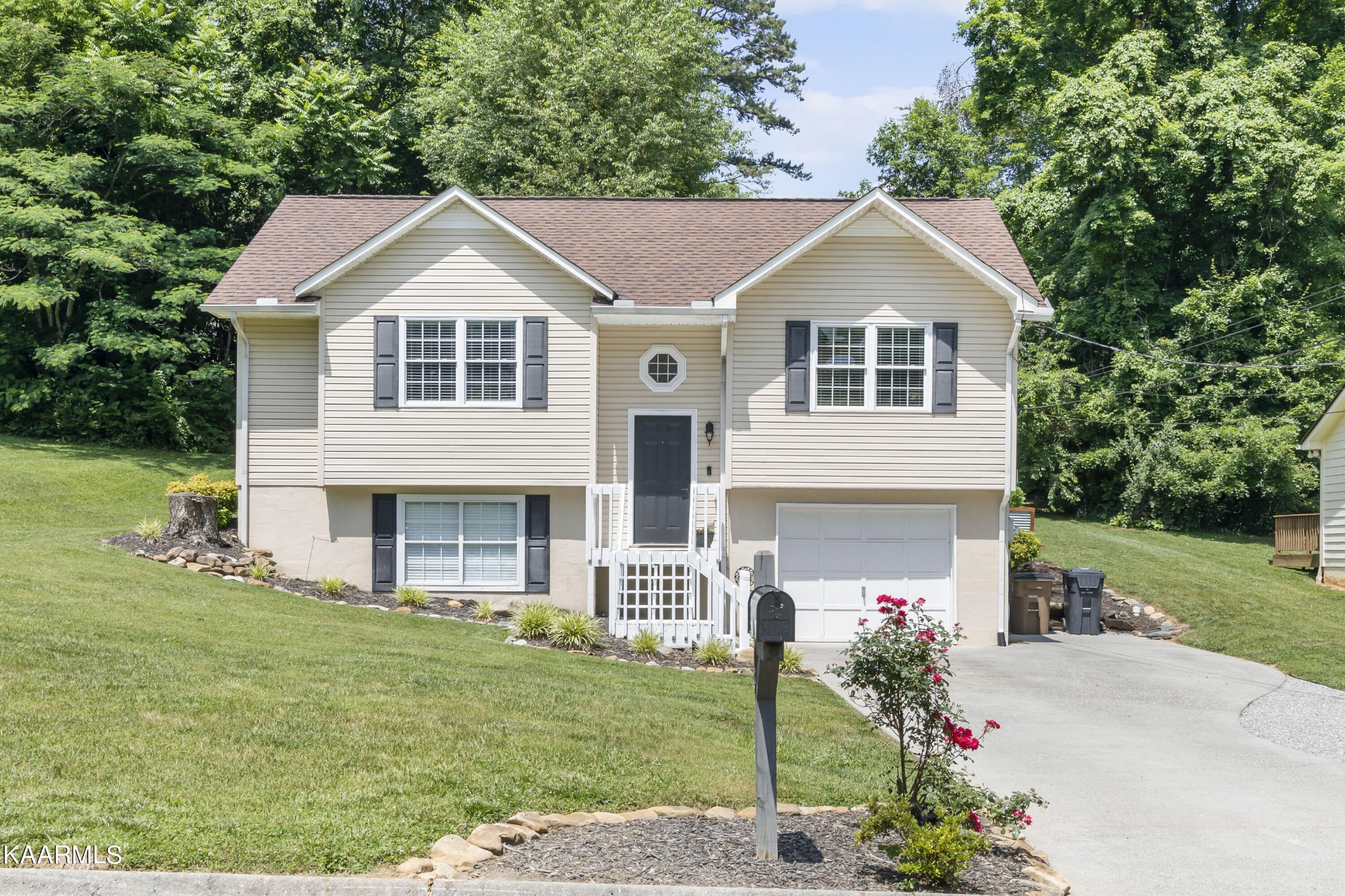3909 Abercorn Road Knoxville, TN 37921 - Photo 1 of 18 a front view of a house with garden