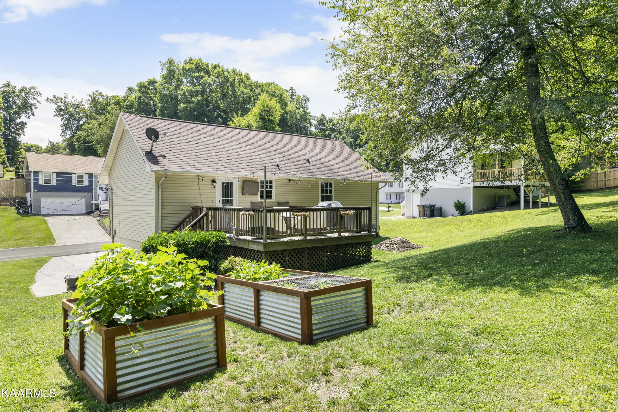 3909 Abercorn Road Knoxville, TN 37921 - Photo 13 of 18 a front view of a house with a yard table and chairs