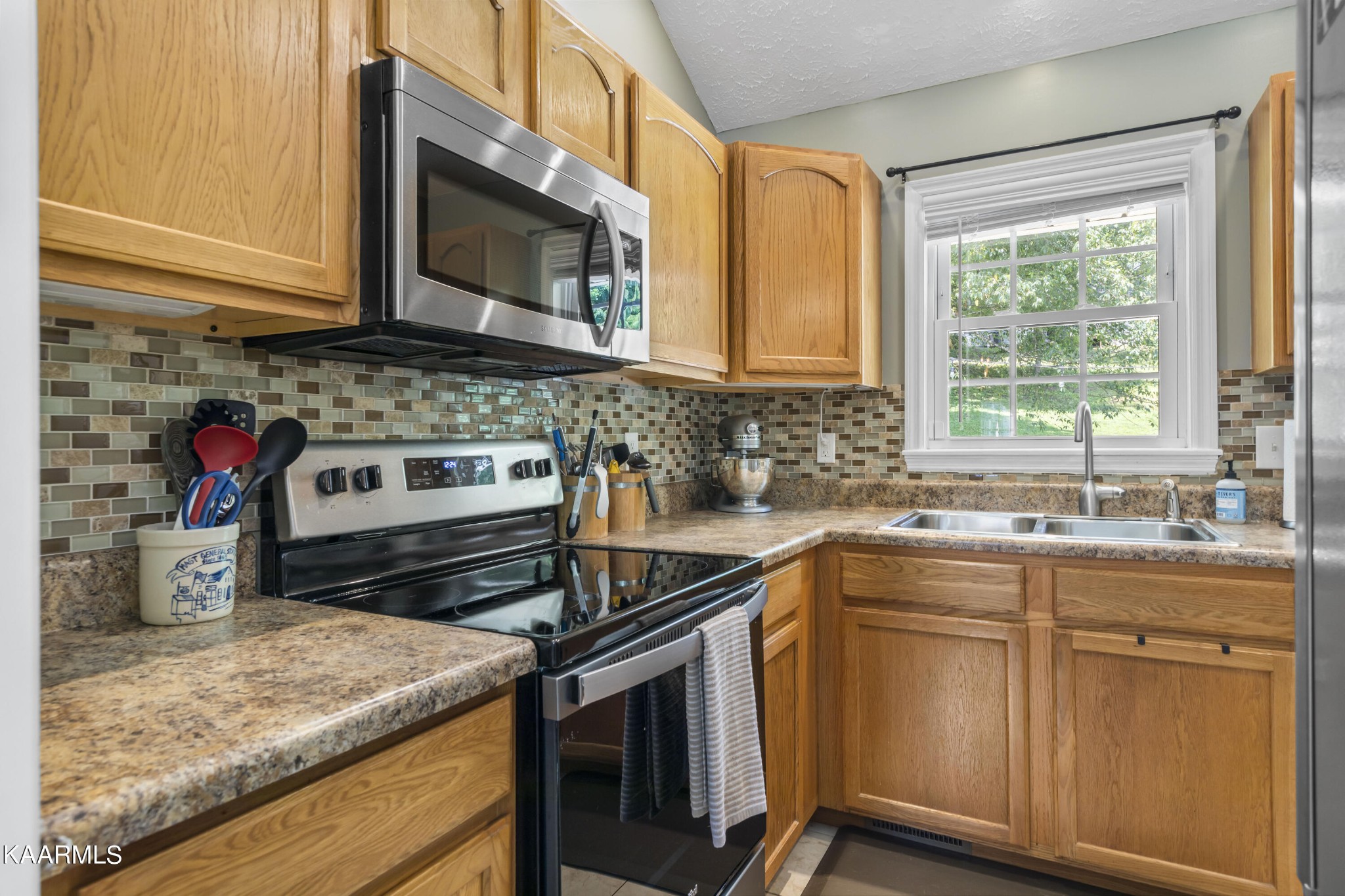 3909 Abercorn Road Knoxville, TN 37921 - Photo 7 of 18 a kitchen with a stove microwave and sink