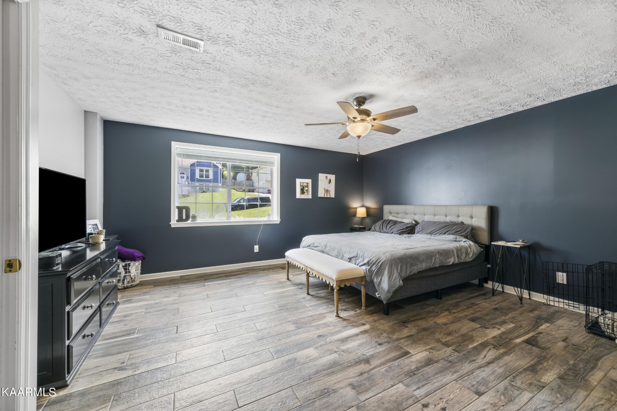 3909 Abercorn Road Knoxville, TN 37921 - Photo 8 of 18 a bedroom with a bed and a flat screen tv