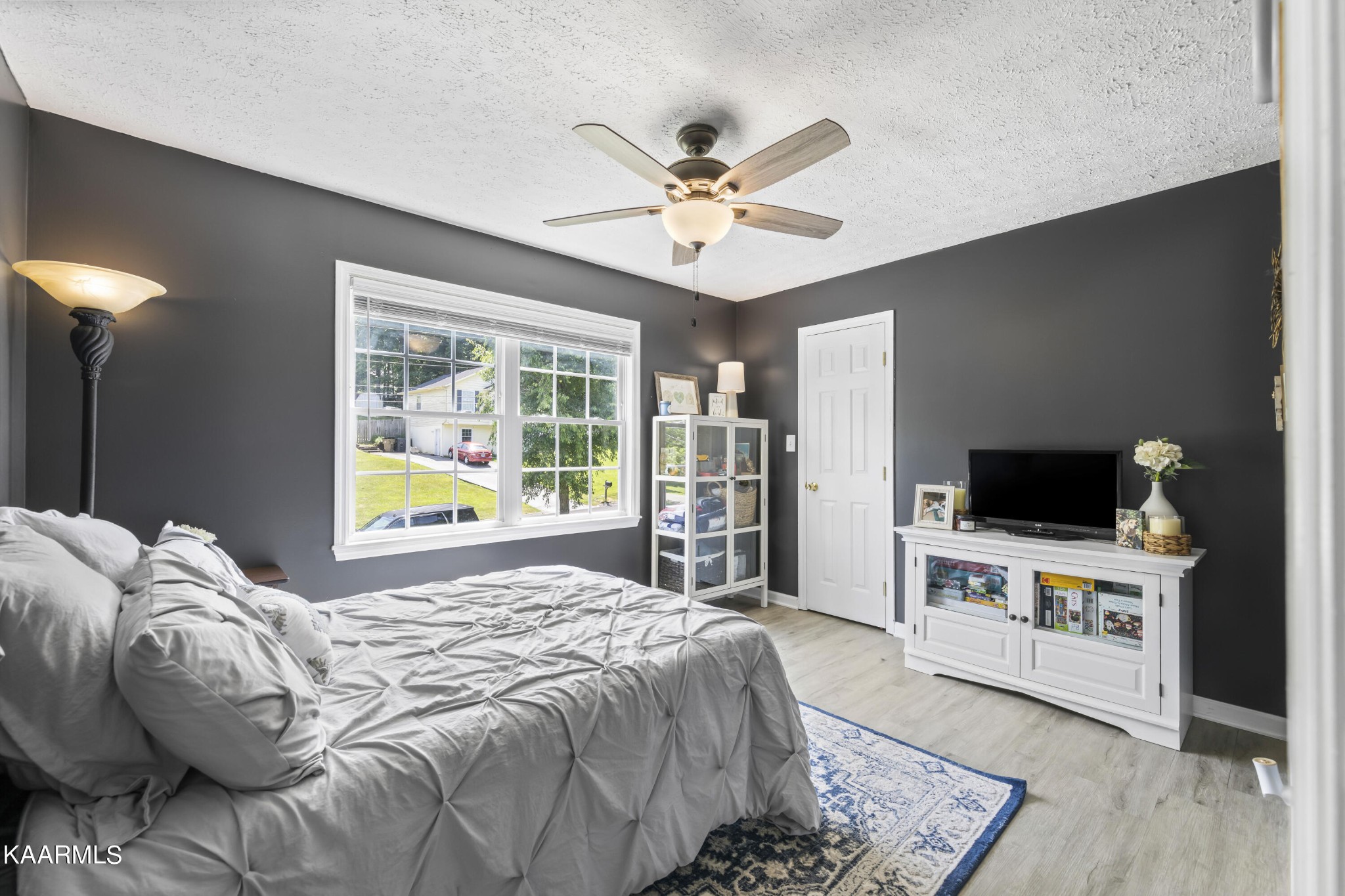 3909 Abercorn Road Knoxville, TN 37921 - Photo 9 of 18 a bedroom with a bed and a flat screen tv