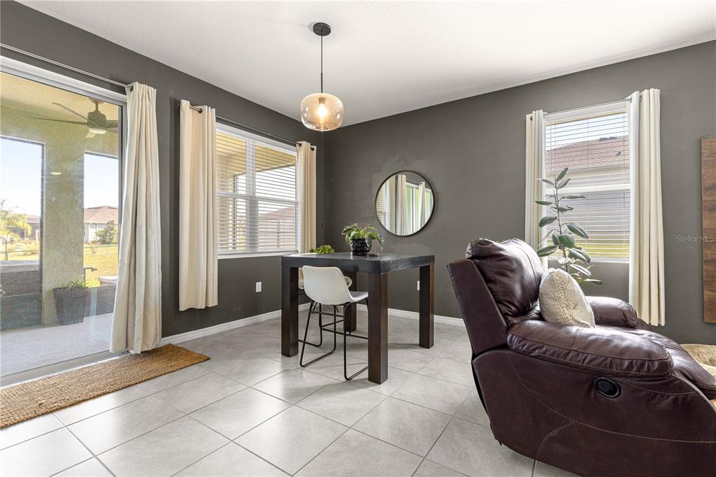 6233 Southwest 89th St Road Ocala, FL 34476 - Photo 11 of 39 a living room with furniture and a large window