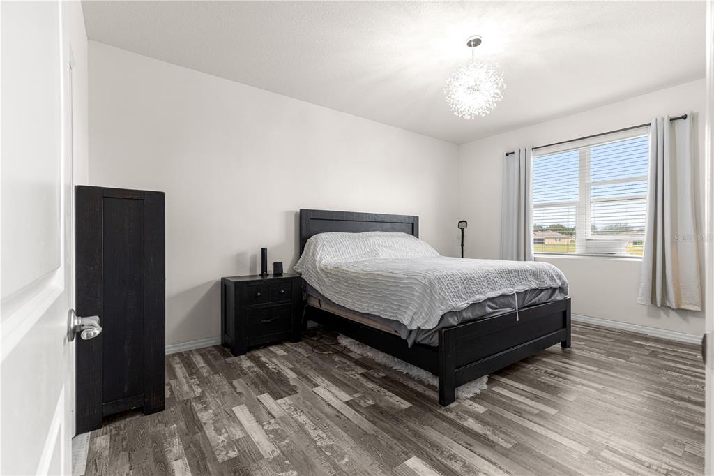 6233 Southwest 89th St Road Ocala, FL 34476 - Photo 16 of 39 a bedroom with a bed and window