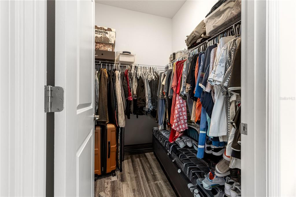 6233 Southwest 89th St Road Ocala, FL 34476 - Photo 17 of 39 a view of walk in closet with clothes