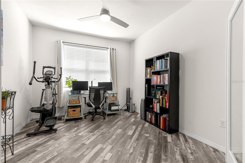 6233 Southwest 89th St Road Ocala, FL 34476 - Photo 24 of 39 a view of a workspace with furniture and a window