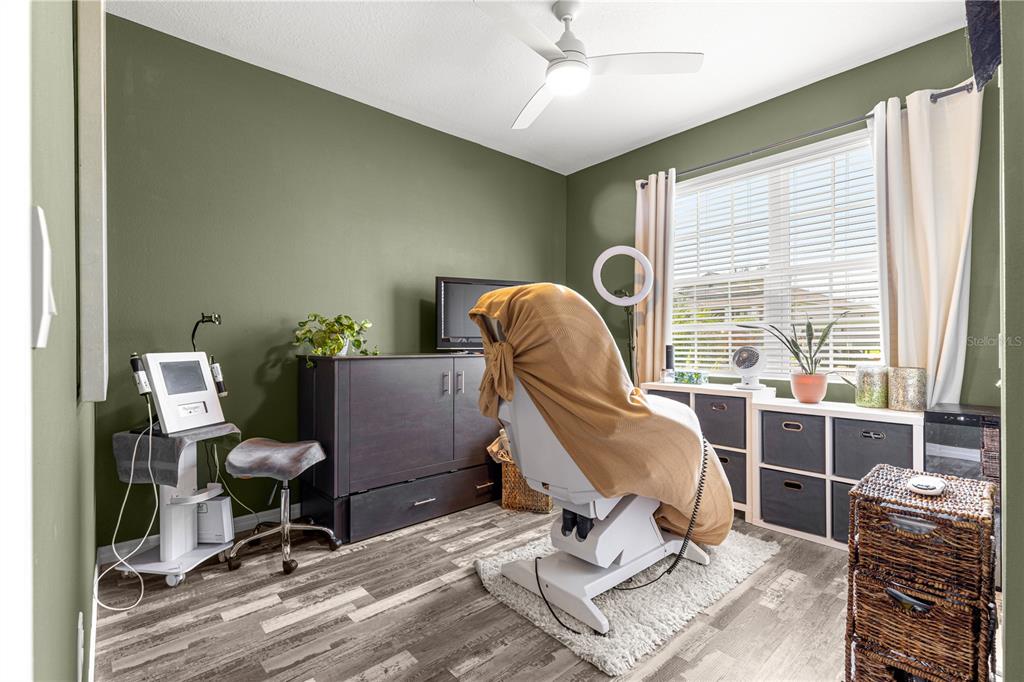 6233 Southwest 89th St Road Ocala, FL 34476 - Photo 26 of 39 a view of a workspace with furniture and a window