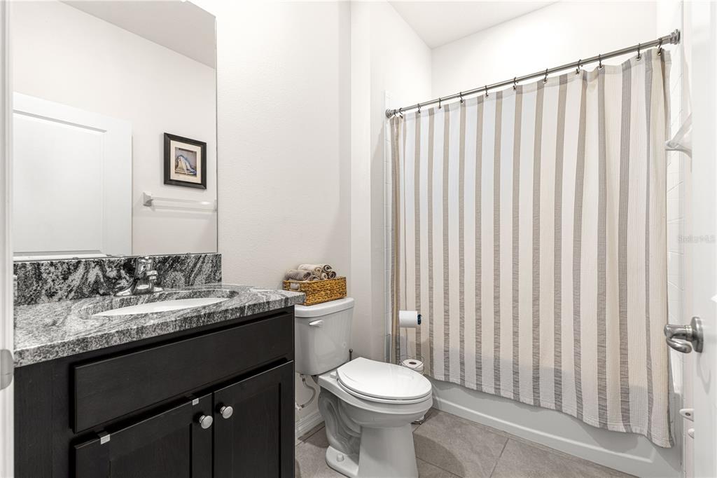 6233 Southwest 89th St Road Ocala, FL 34476 - Photo 27 of 39 a bathroom with a sink vanity mirror and toilet