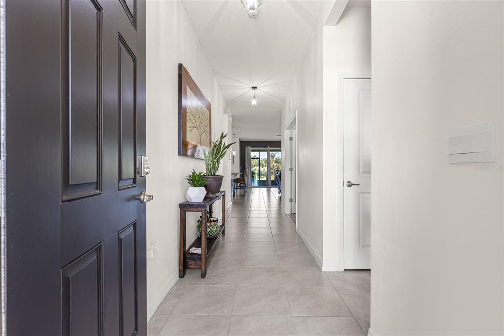 6233 Southwest 89th St Road Ocala, FL 34476 - Photo 3 of 39 a view of hallway with livingroom