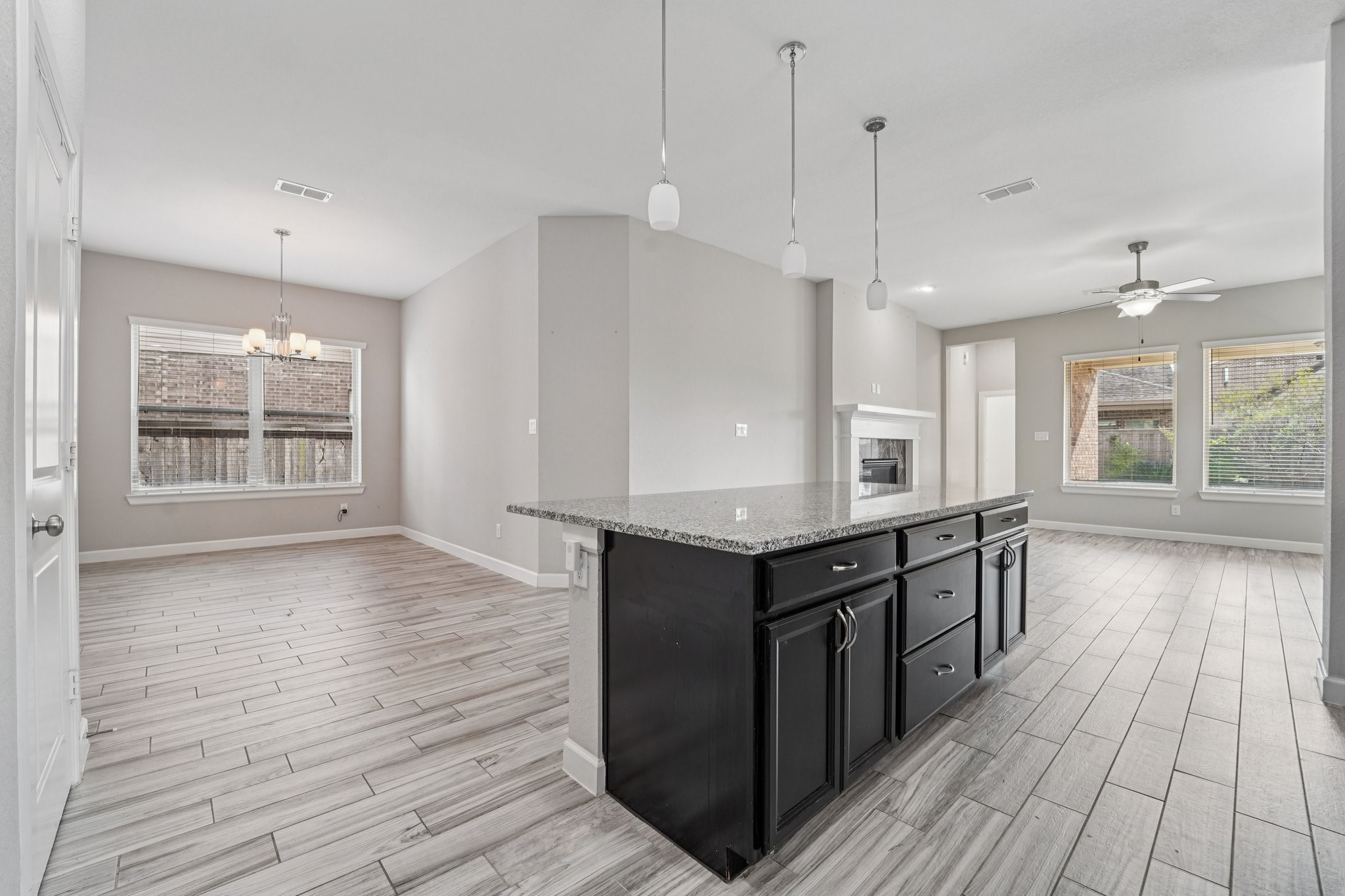 19751 Shinnery Ridge Court Cypress, TX 77433 - Photo 10 of 43 an empty room with wooden floor and windows