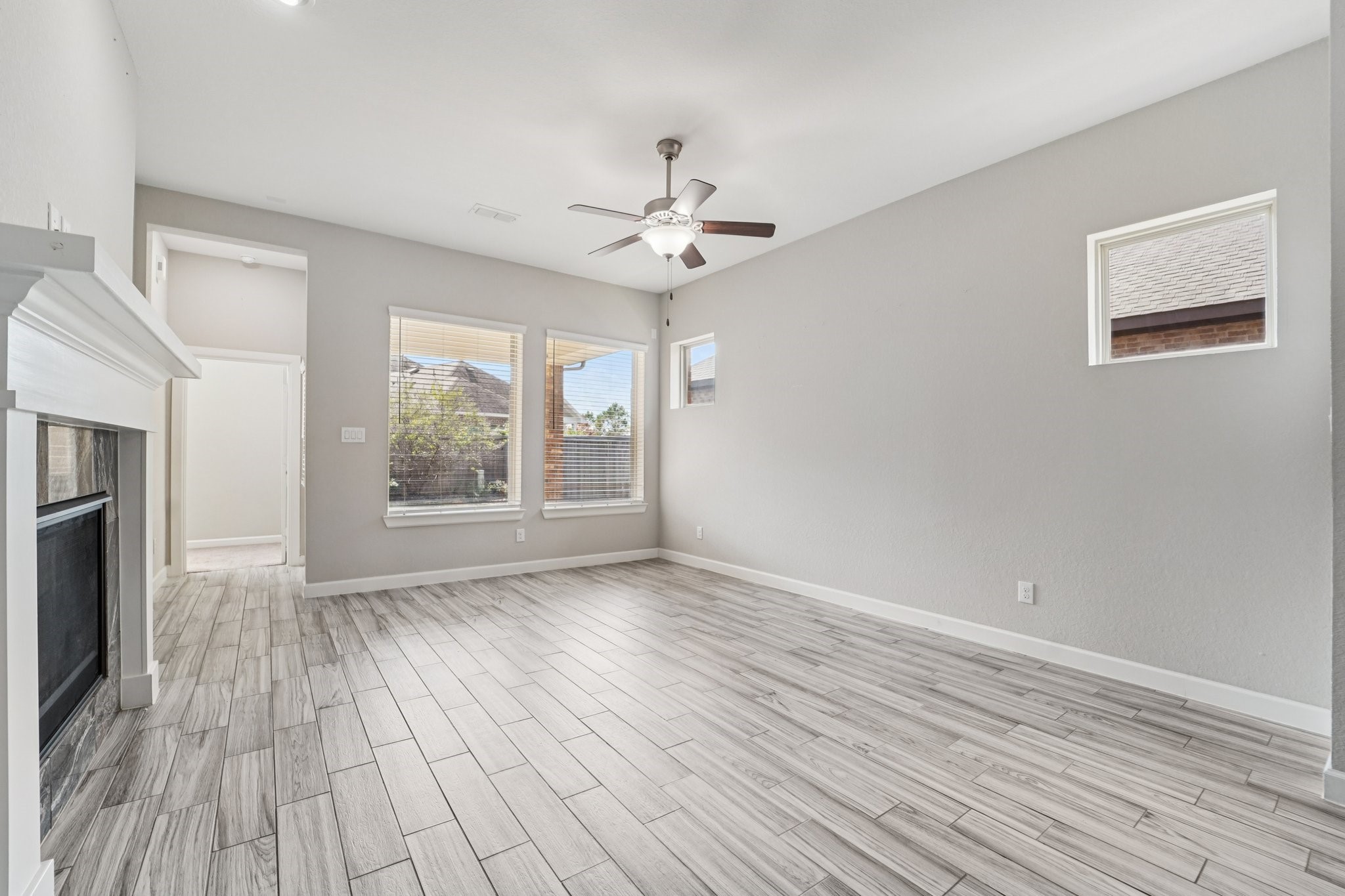 19751 Shinnery Ridge Court Cypress, TX 77433 - Photo 12 of 43 wooden floor in an empty room with a window