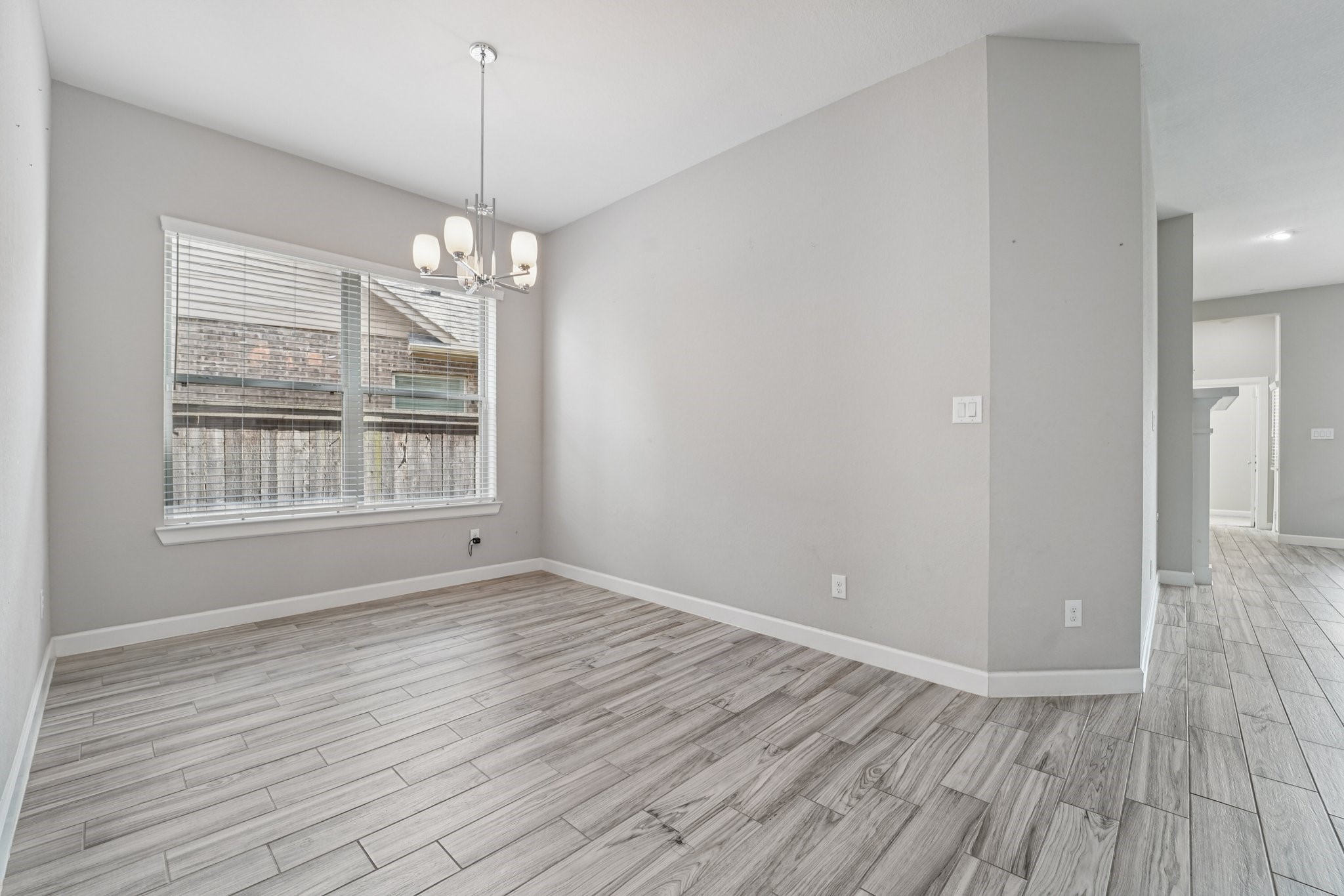 19751 Shinnery Ridge Court Cypress, TX 77433 - Photo 13 of 43 wooden floor in an empty room with a window