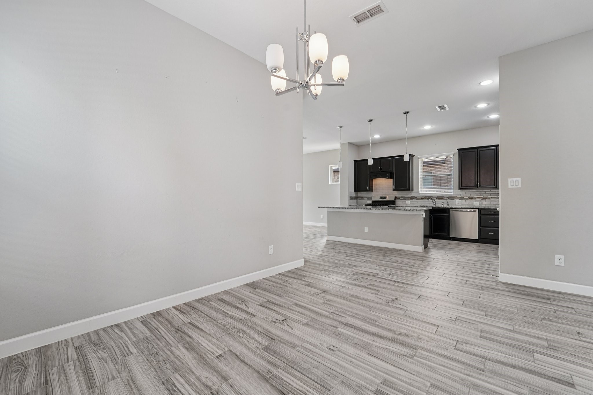 19751 Shinnery Ridge Court Cypress, TX 77433 - Photo 14 of 43 a view of a kitchen with microwave and cabinets