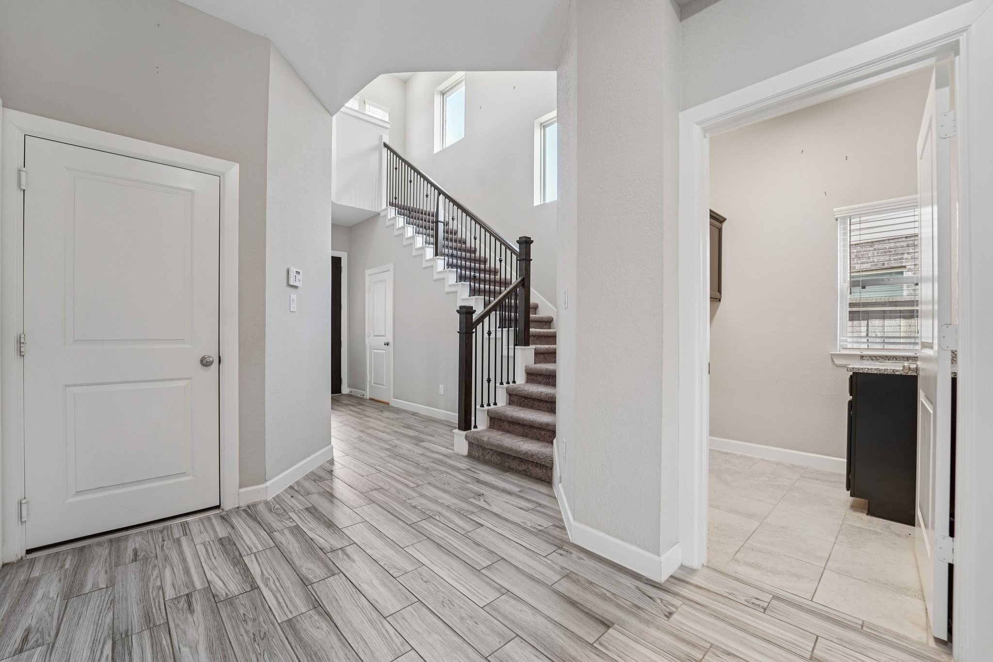 19751 Shinnery Ridge Court Cypress, TX 77433 - Photo 15 of 43 a view of hallway with wooden floor and stairs