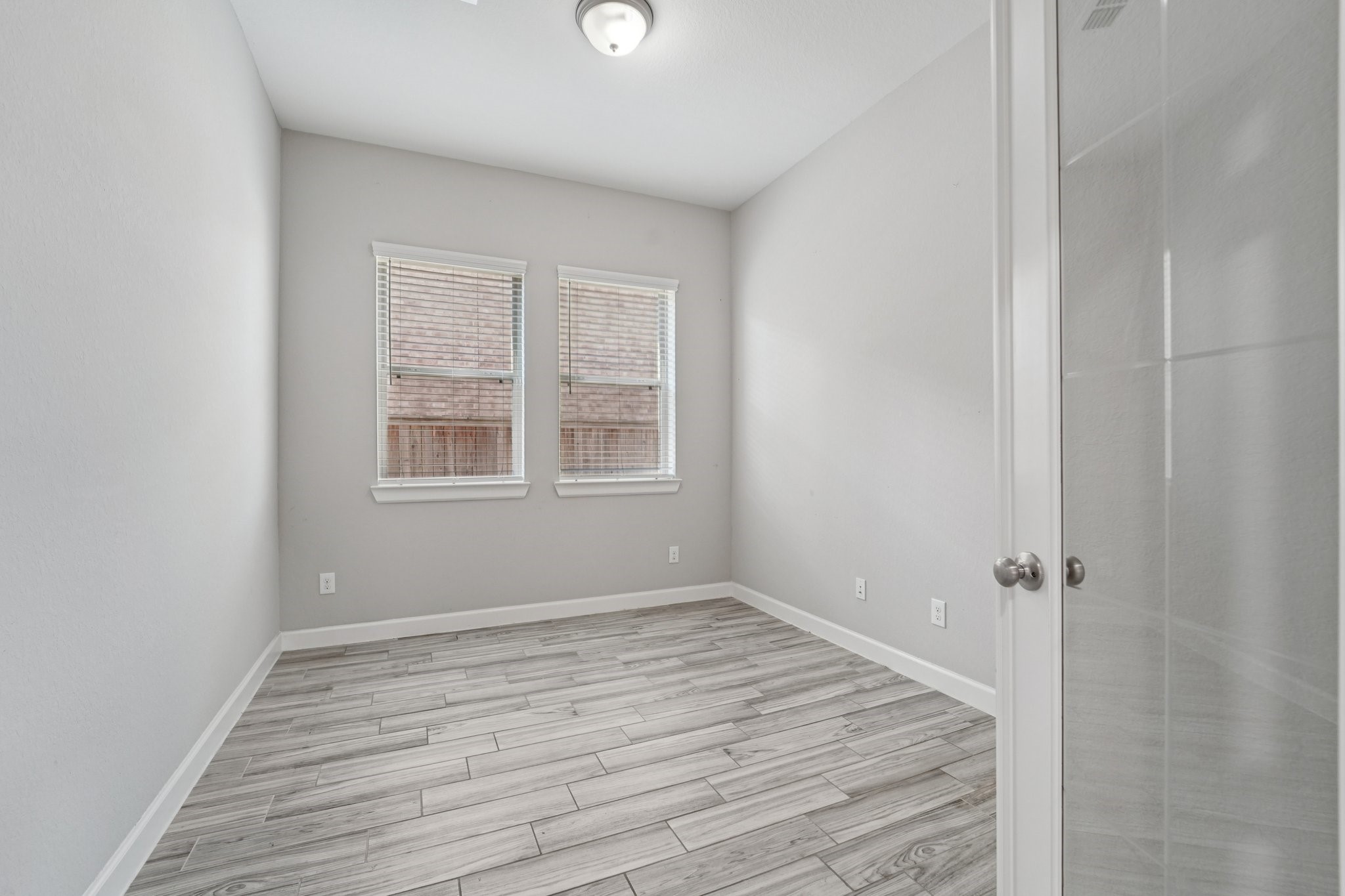 19751 Shinnery Ridge Court Cypress, TX 77433 - Photo 16 of 43 a view of a room with wooden floor and window