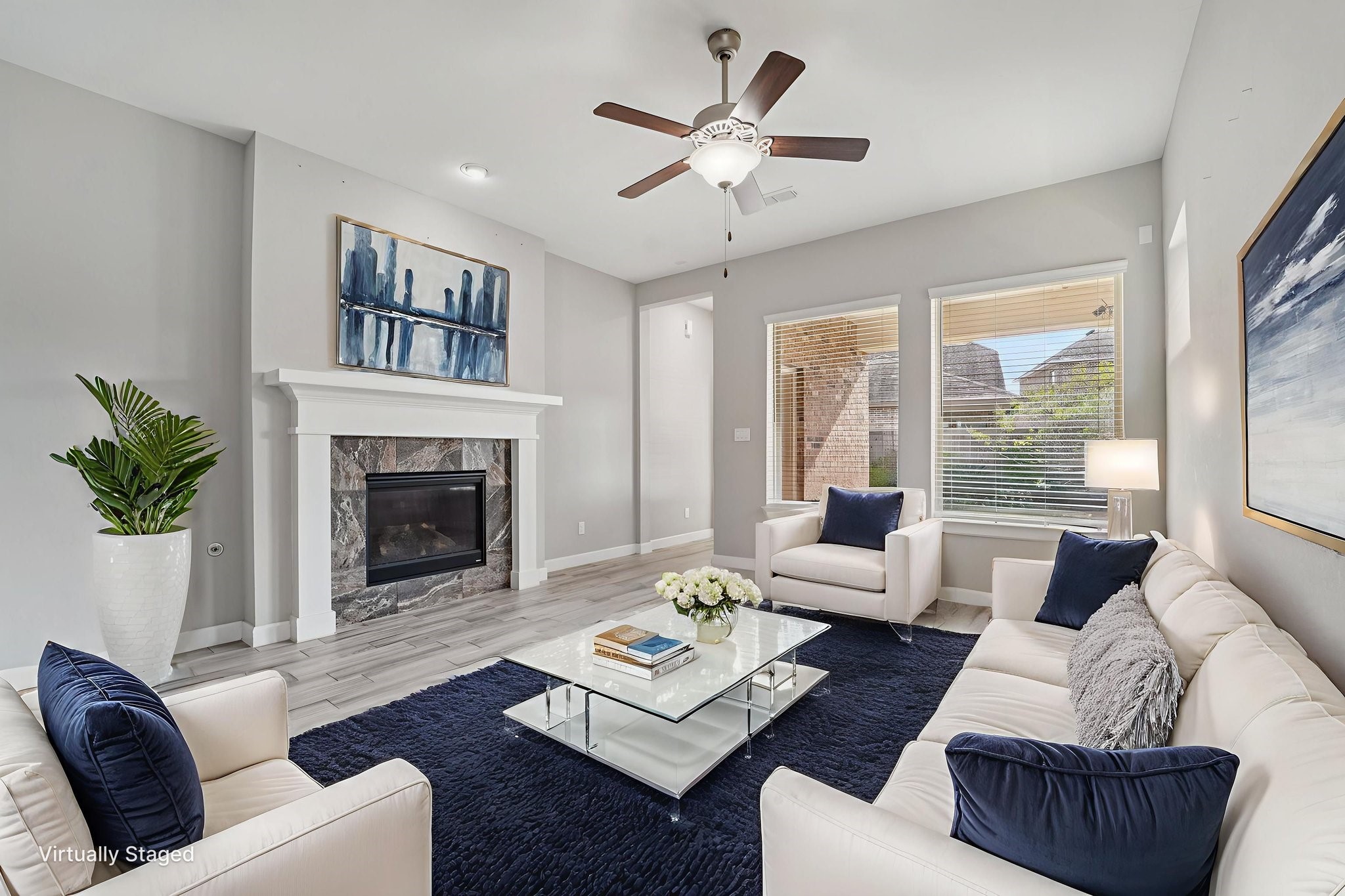 19751 Shinnery Ridge Court Cypress, TX 77433 - Photo 2 of 43 a living room with furniture fireplace and a large window