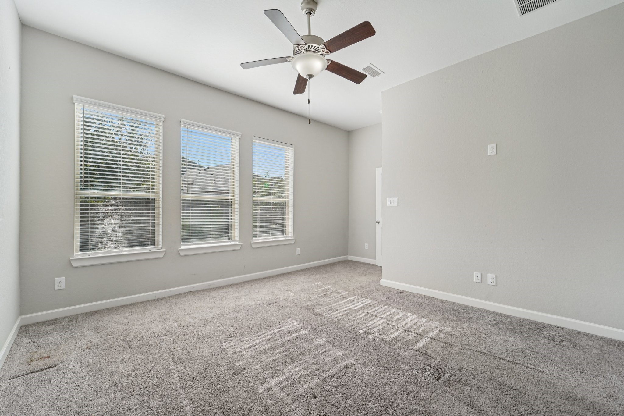 19751 Shinnery Ridge Court Cypress, TX 77433 - Photo 20 of 43 an empty room with windows and fan