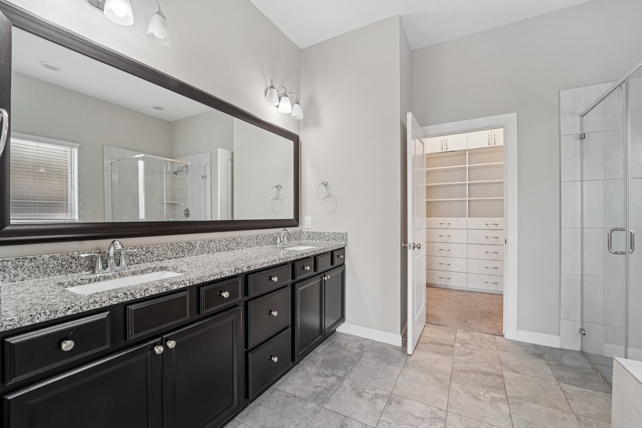19751 Shinnery Ridge Court Cypress, TX 77433 - Photo 22 of 43 a bathroom with a granite countertop sink and a mirror
