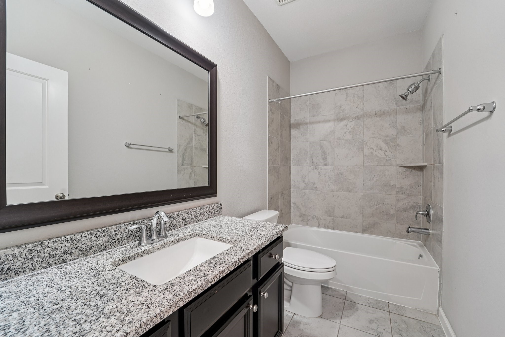 19751 Shinnery Ridge Court Cypress, TX 77433 - Photo 28 of 43 a bathroom with a granite countertop sink toilet and shower