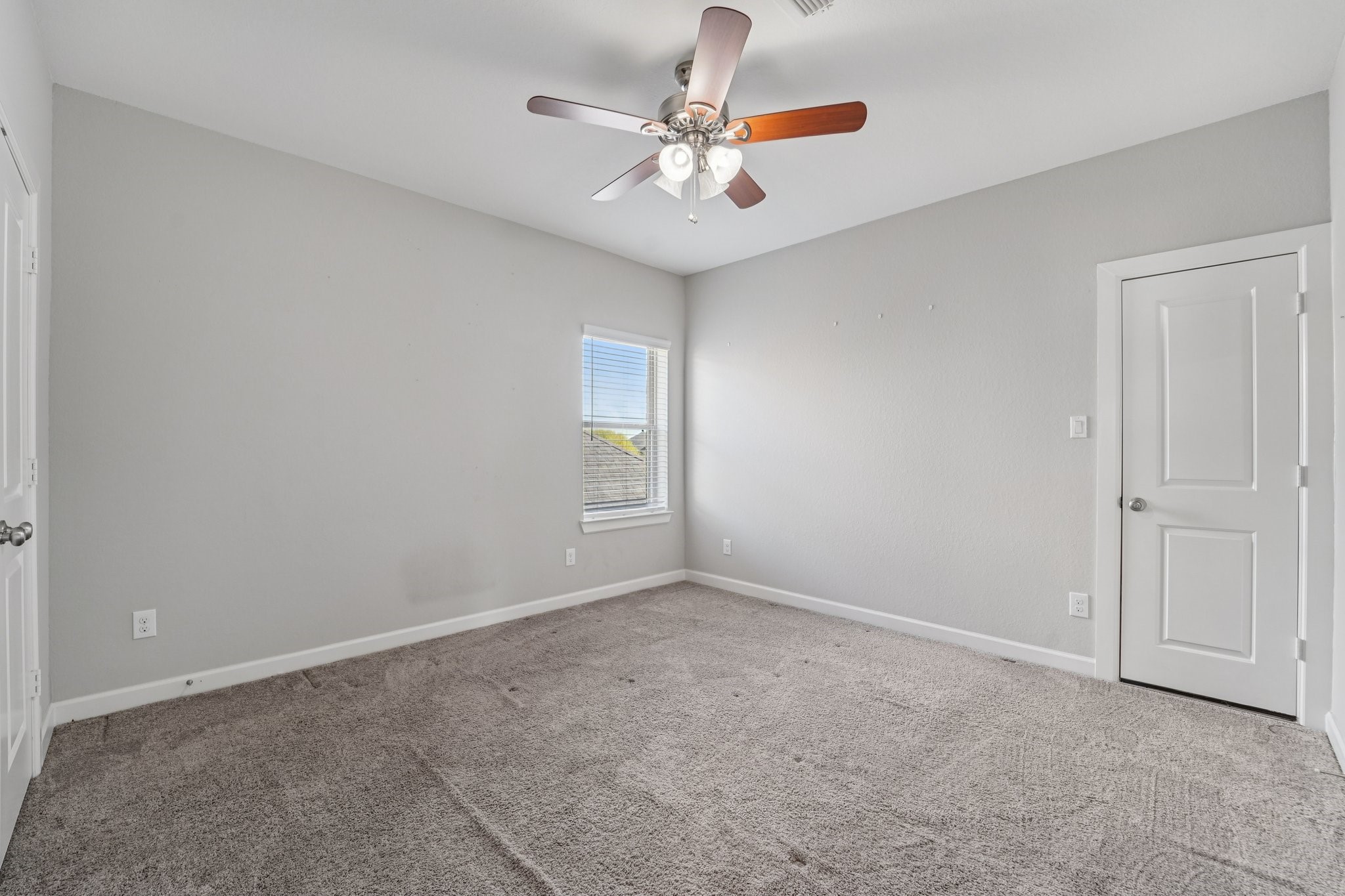 19751 Shinnery Ridge Court Cypress, TX 77433 - Photo 29 of 43 an empty room with windows and fan