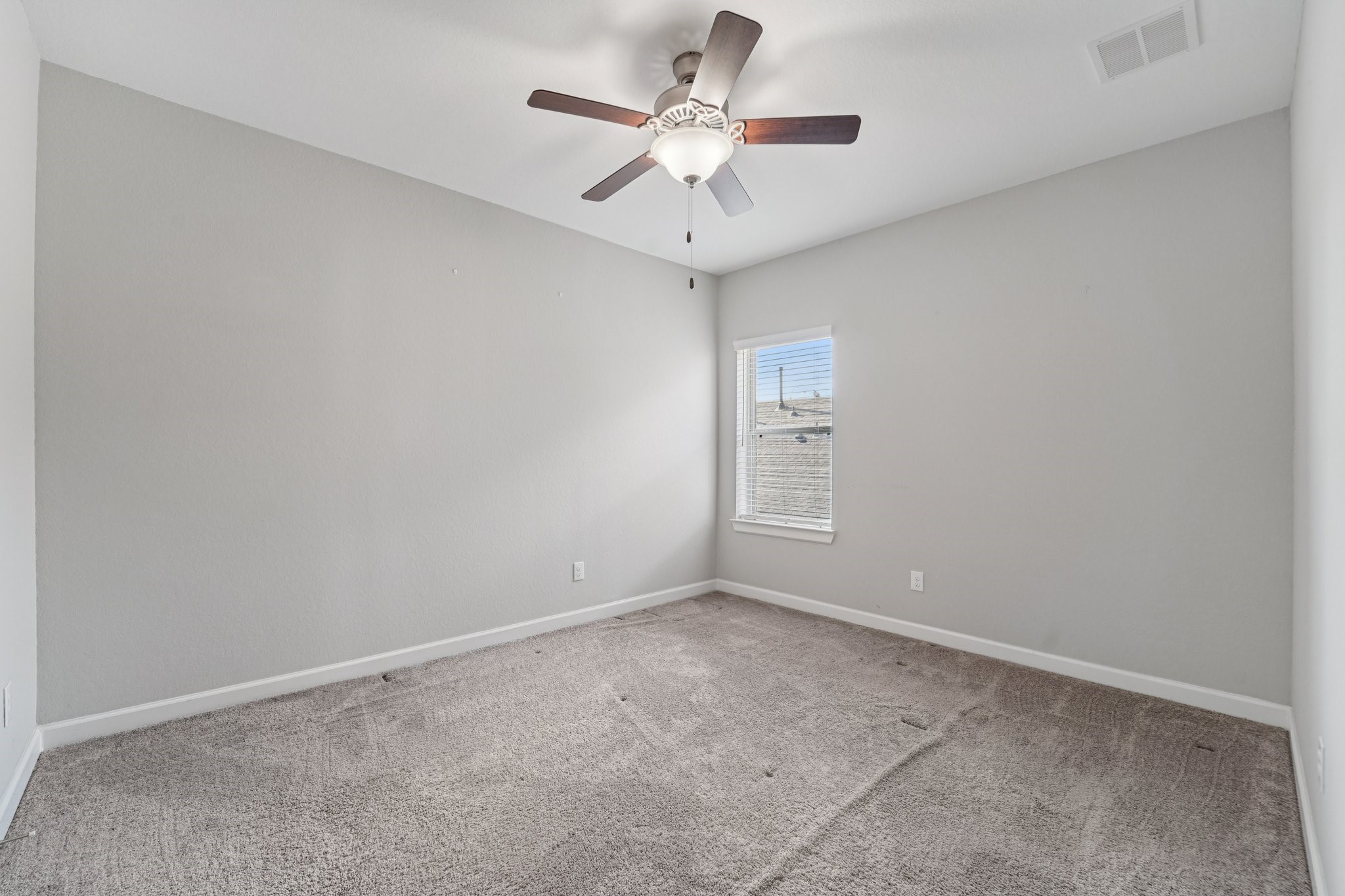 19751 Shinnery Ridge Court Cypress, TX 77433 - Photo 31 of 43 a view of an empty room with a ceiling fan