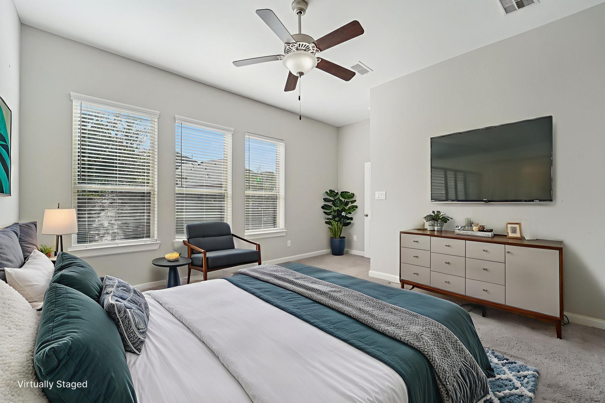 19751 Shinnery Ridge Court Cypress, TX 77433 - Photo 4 of 43 a bedroom with a bed and a flat screen tv