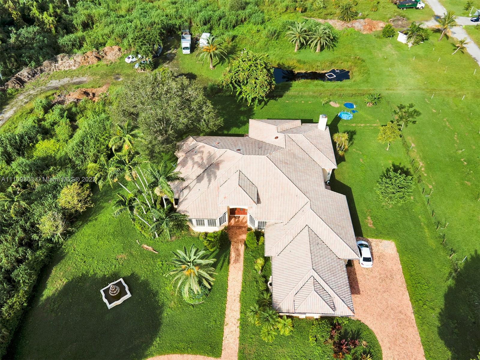 5879 Southwest 178th Avenue Southwest Ranches, FL 33331 - Photo 12 of 27 an aerial view of a house with pool yard outdoor and green space