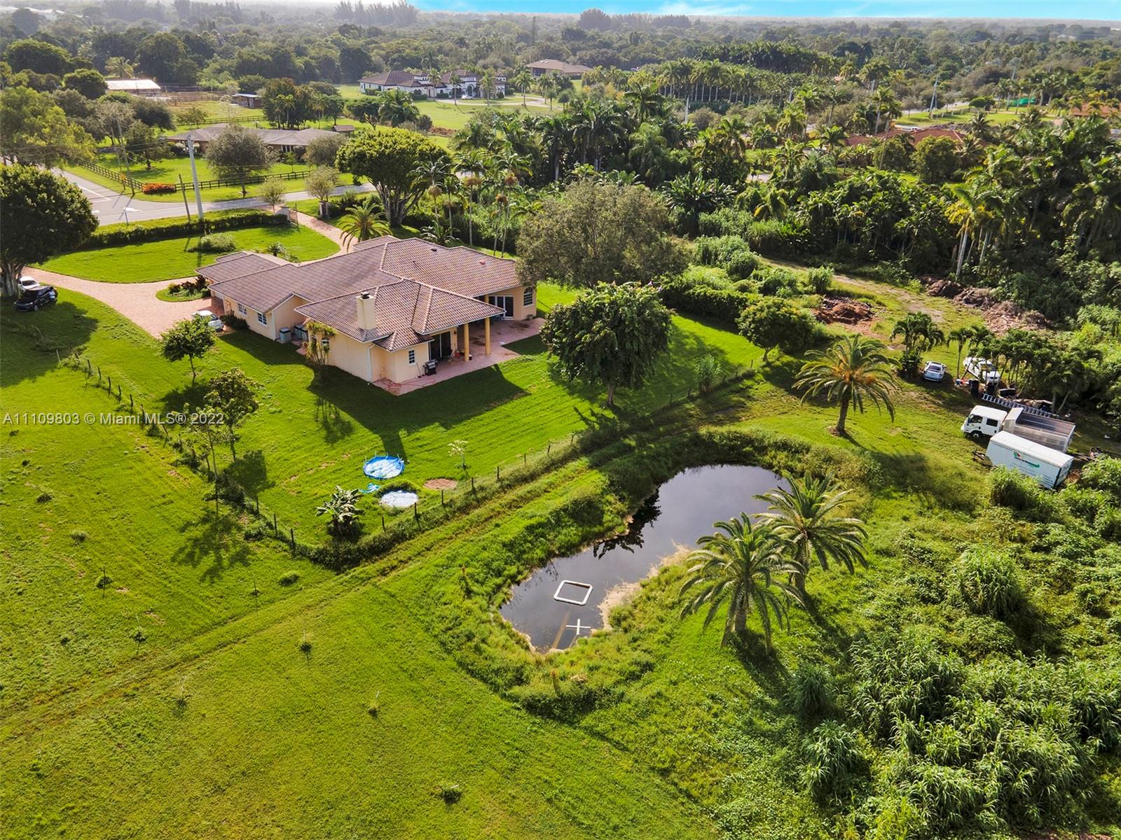 5879 Southwest 178th Avenue Southwest Ranches, FL 33331 - Photo 13 of 27 an aerial view of a house with a yard