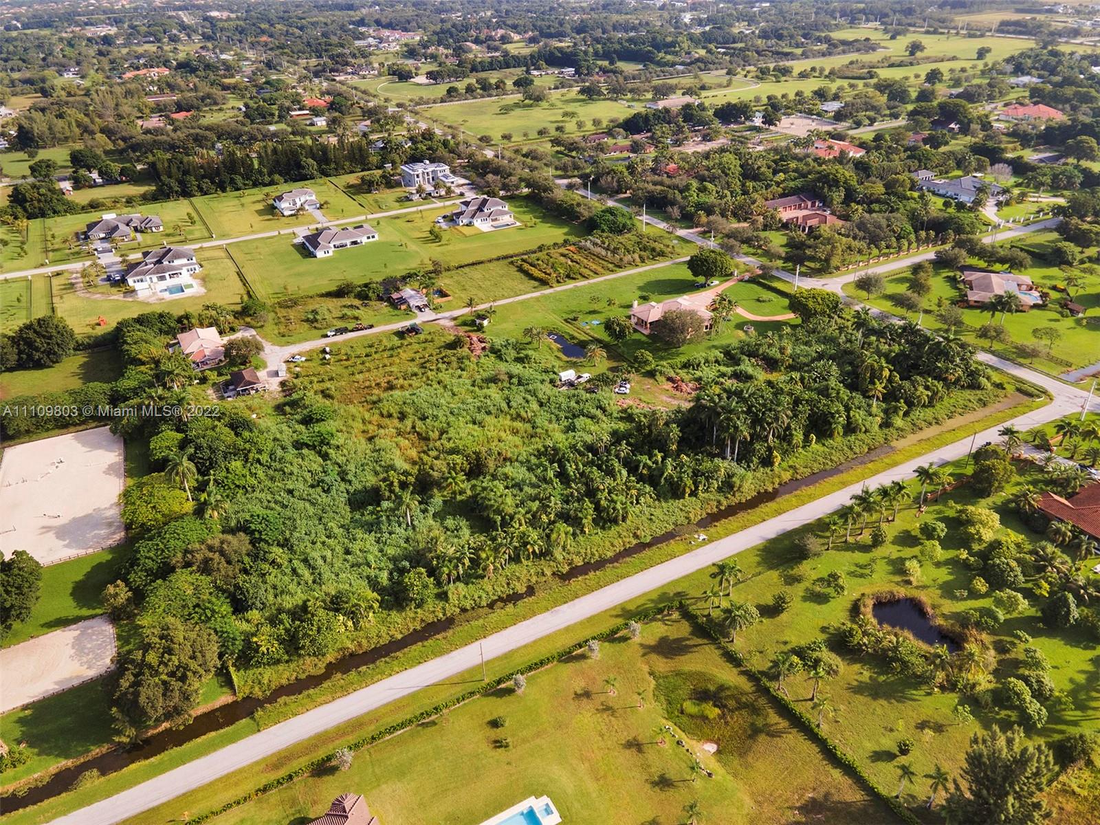 5879 Southwest 178th Avenue Southwest Ranches, FL 33331 - Photo 24 of 27 an aerial view of residential houses with outdoor space
