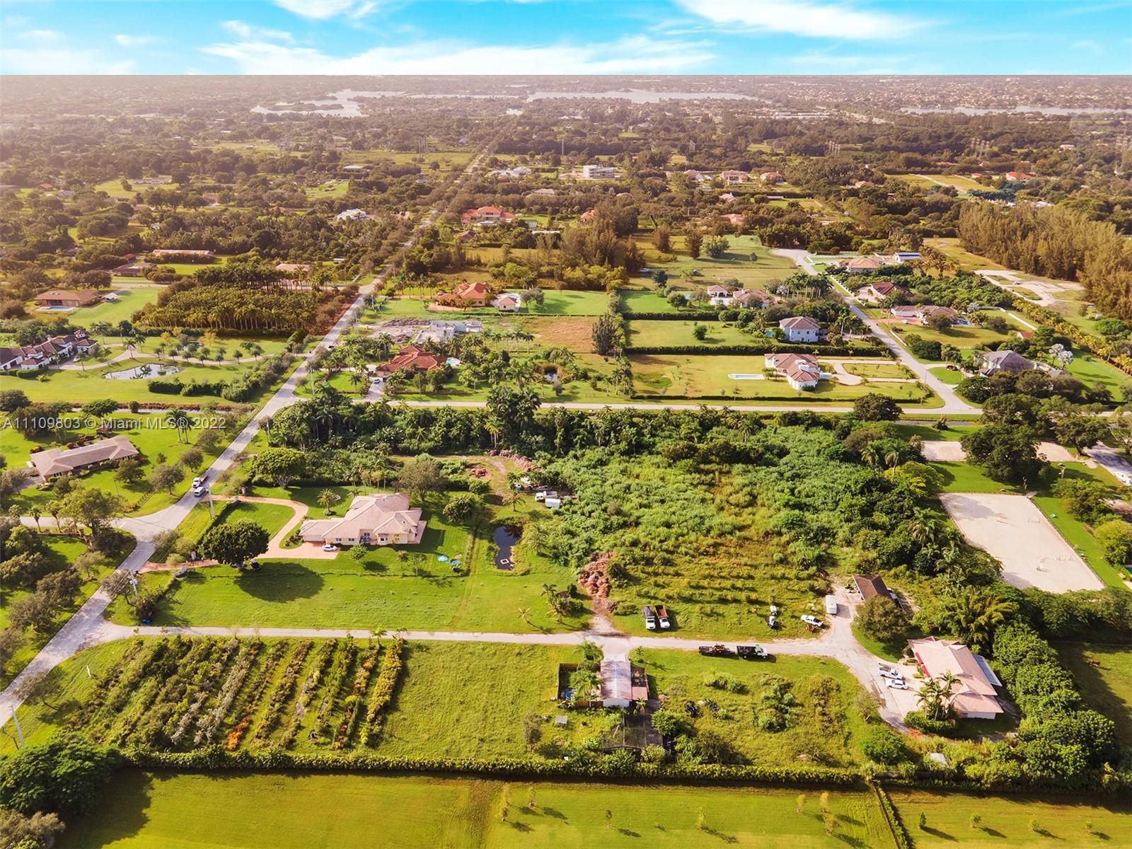 5879 Southwest 178th Avenue Southwest Ranches, FL 33331 - Photo 26 of 27 a view of residential houses with yard
