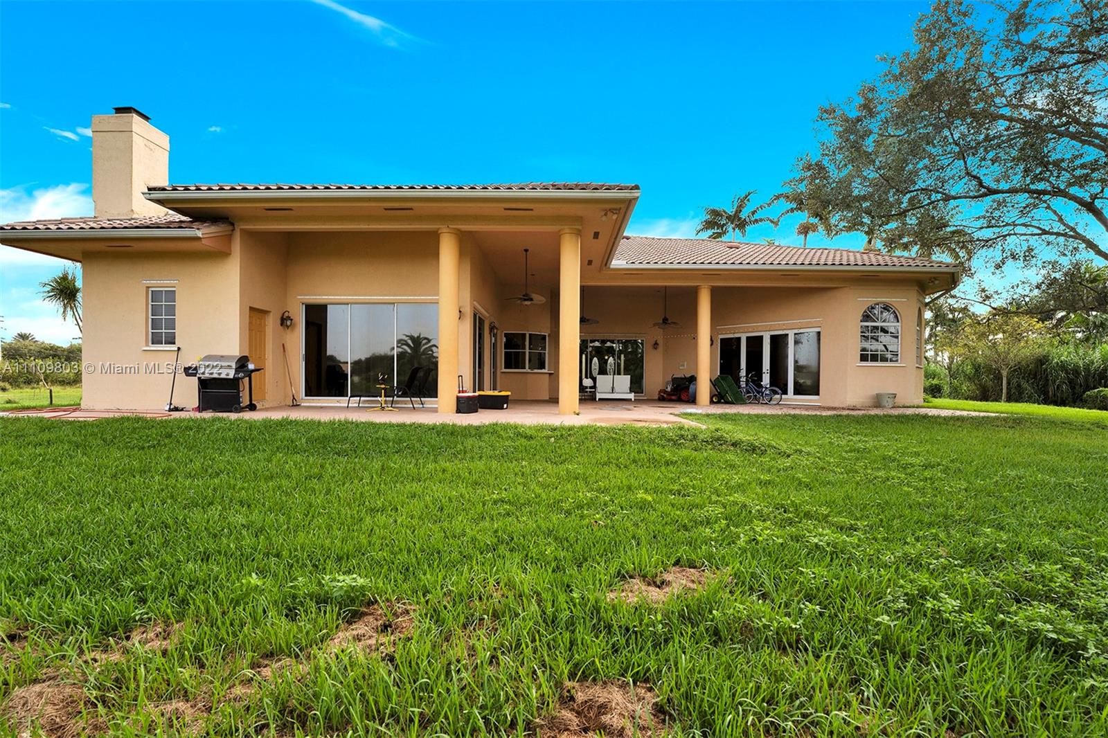 5879 Southwest 178th Avenue Southwest Ranches, FL 33331 - Photo 7 of 27 a view of a house with a backyard