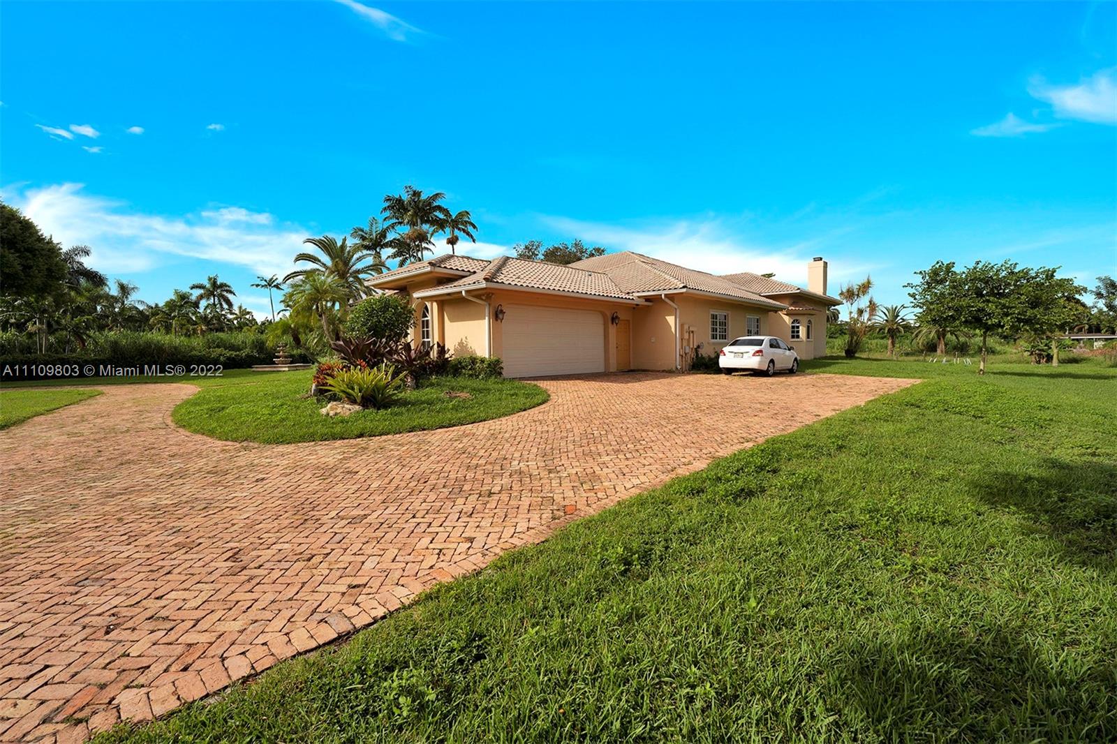 5879 Southwest 178th Avenue Southwest Ranches, FL 33331 - Photo 9 of 27 a view of a house with a yard and potted plants