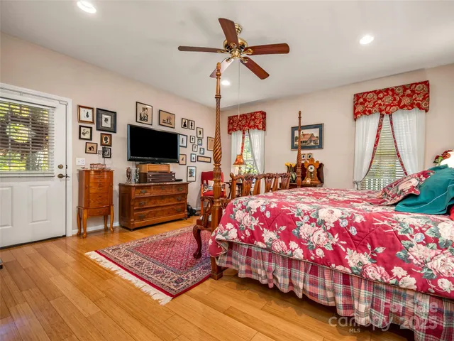 a spacious bathroom with a tub sink and mirror