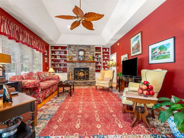 a living room with furniture a rug and a flat screen tv