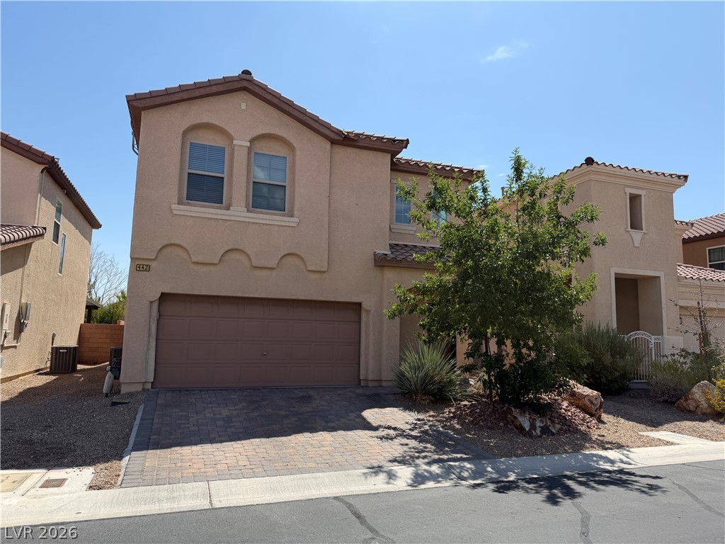 442 White Heart Road Las Vegas, NV 89148 - Photo 1 of 25 Arched windows and stucco siding define the exterior of this two-story residential design.