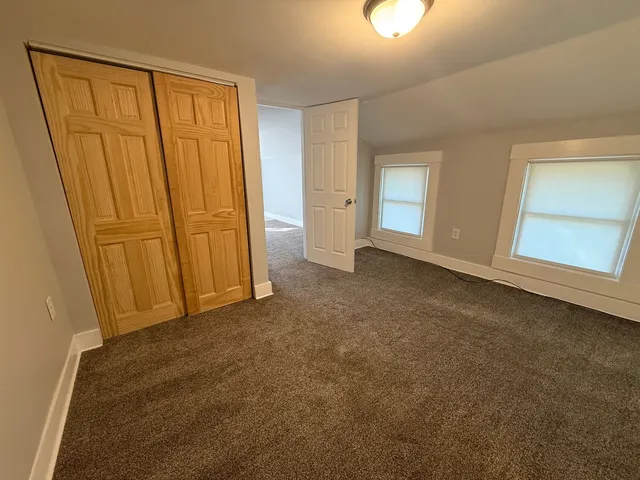 a kitchen with a sink a stove and cabinets