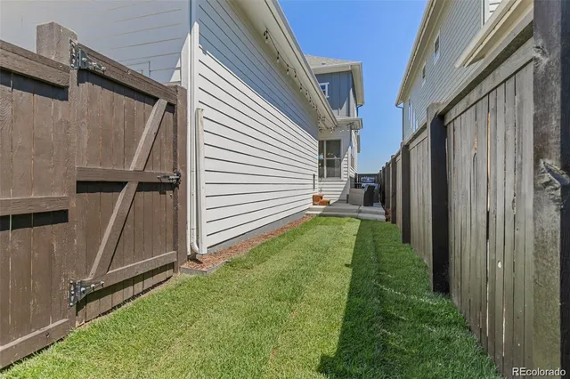 a backyard of a house with a garden and stairs