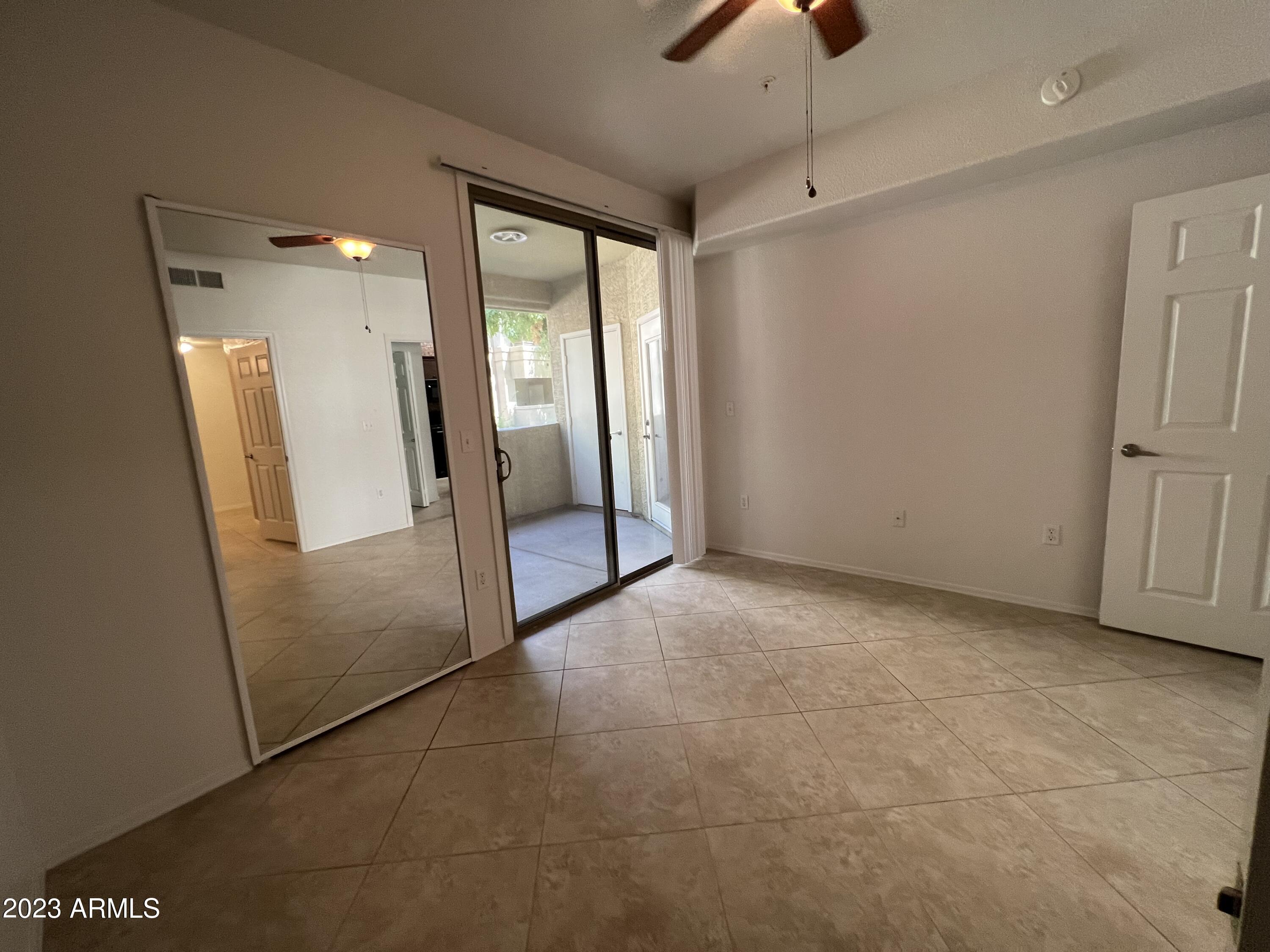 18416 North Cave Creek Road, Unit 1059 Phoenix, AZ 85032 - Photo 22 of 45 Bedroom w/doors to courtyard