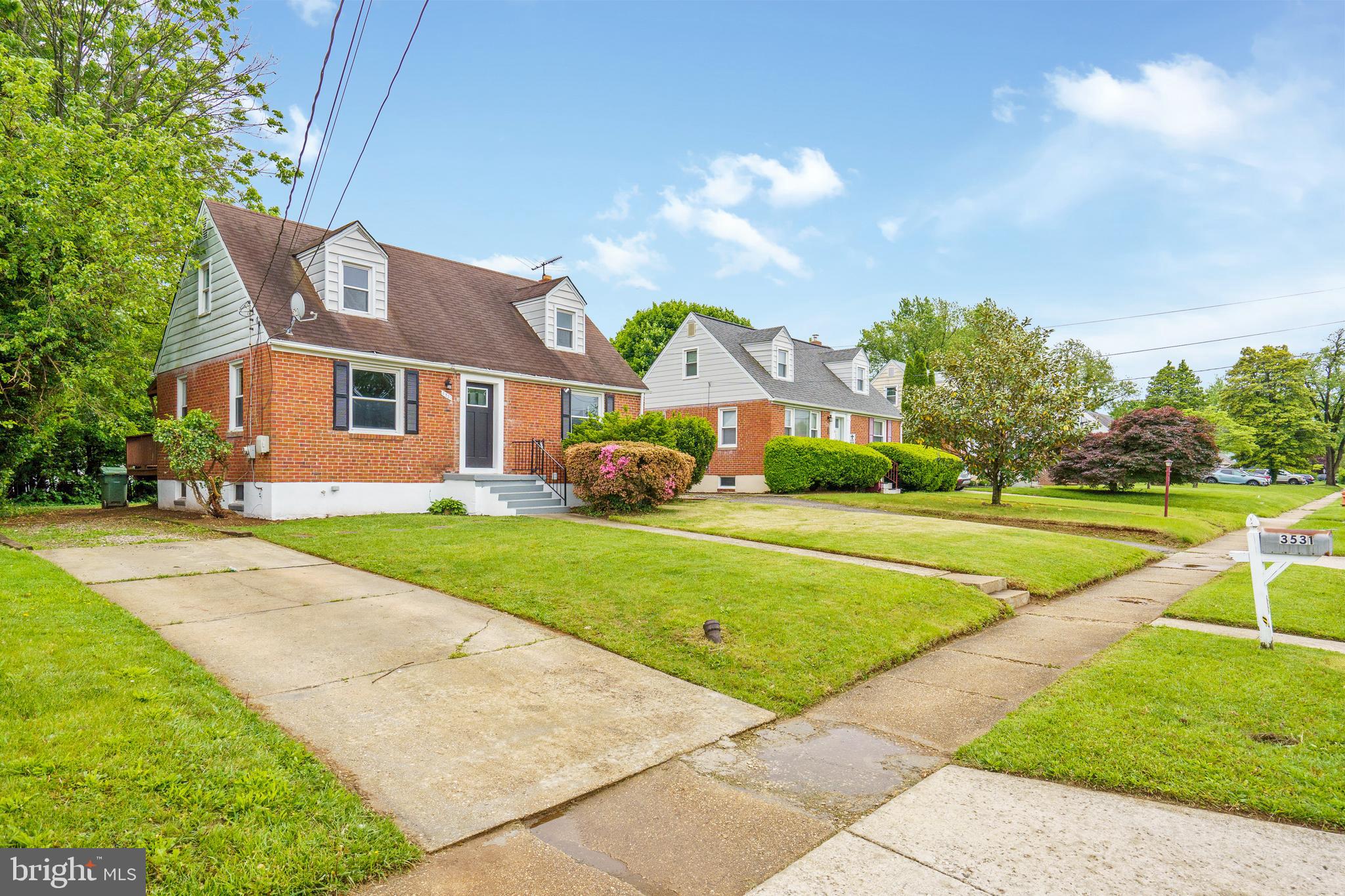 3531 Milford Mill Road Baltimore, MD 21244 - Photo 2 of 49 a front view of a house with a yard and trees