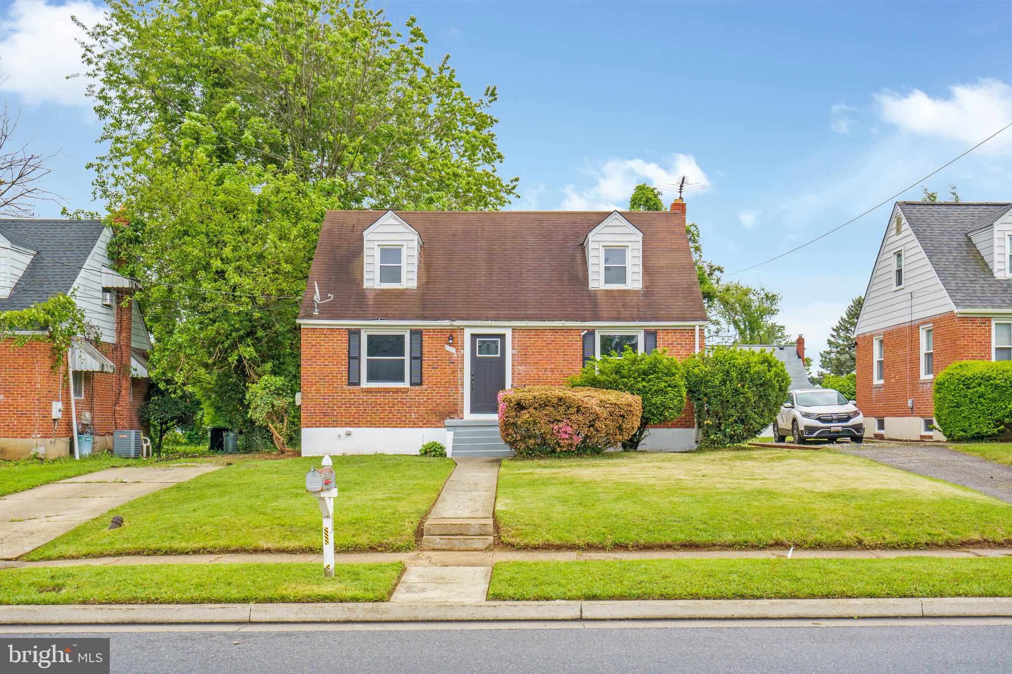 3531 Milford Mill Road Baltimore, MD 21244 - Photo 3 of 49 a front view of a house with a yard