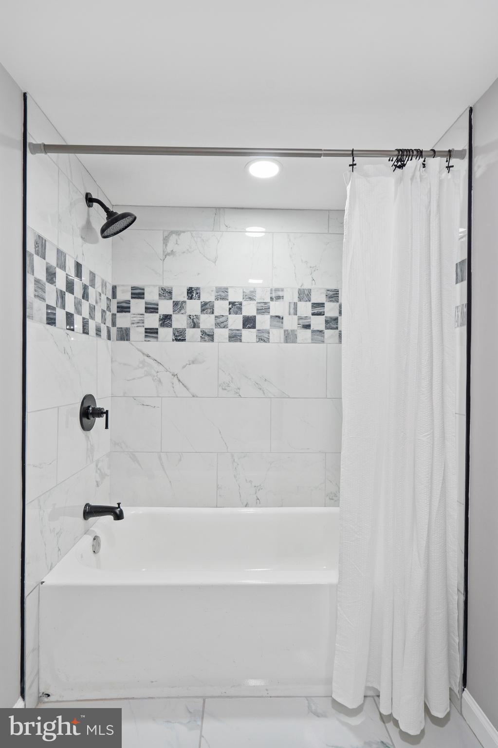 3531 Milford Mill Road Baltimore, MD 21244 - Photo 39 of 49 a bathroom with a shower and a bathtub
